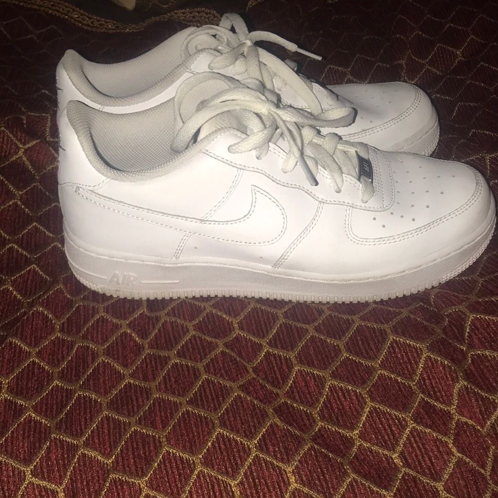 All white low Air Force 1s